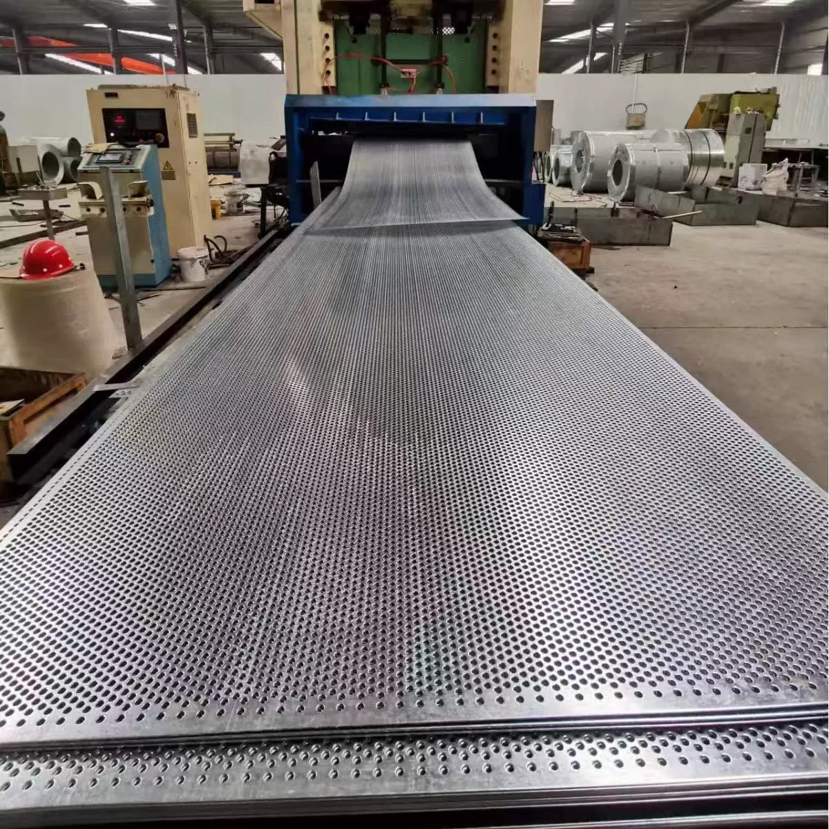 Perforated metal sheet production